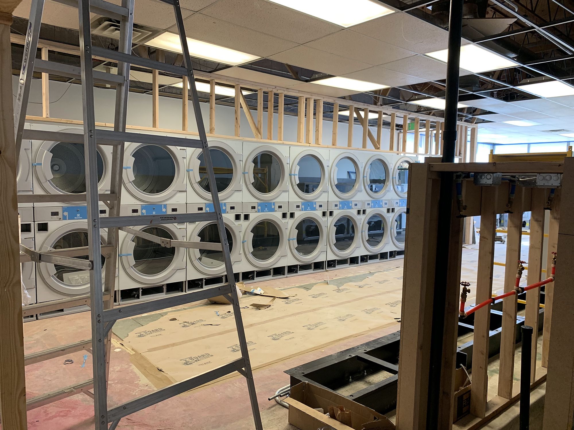 Laundromat build-out — Empty shells turned into working businesses.