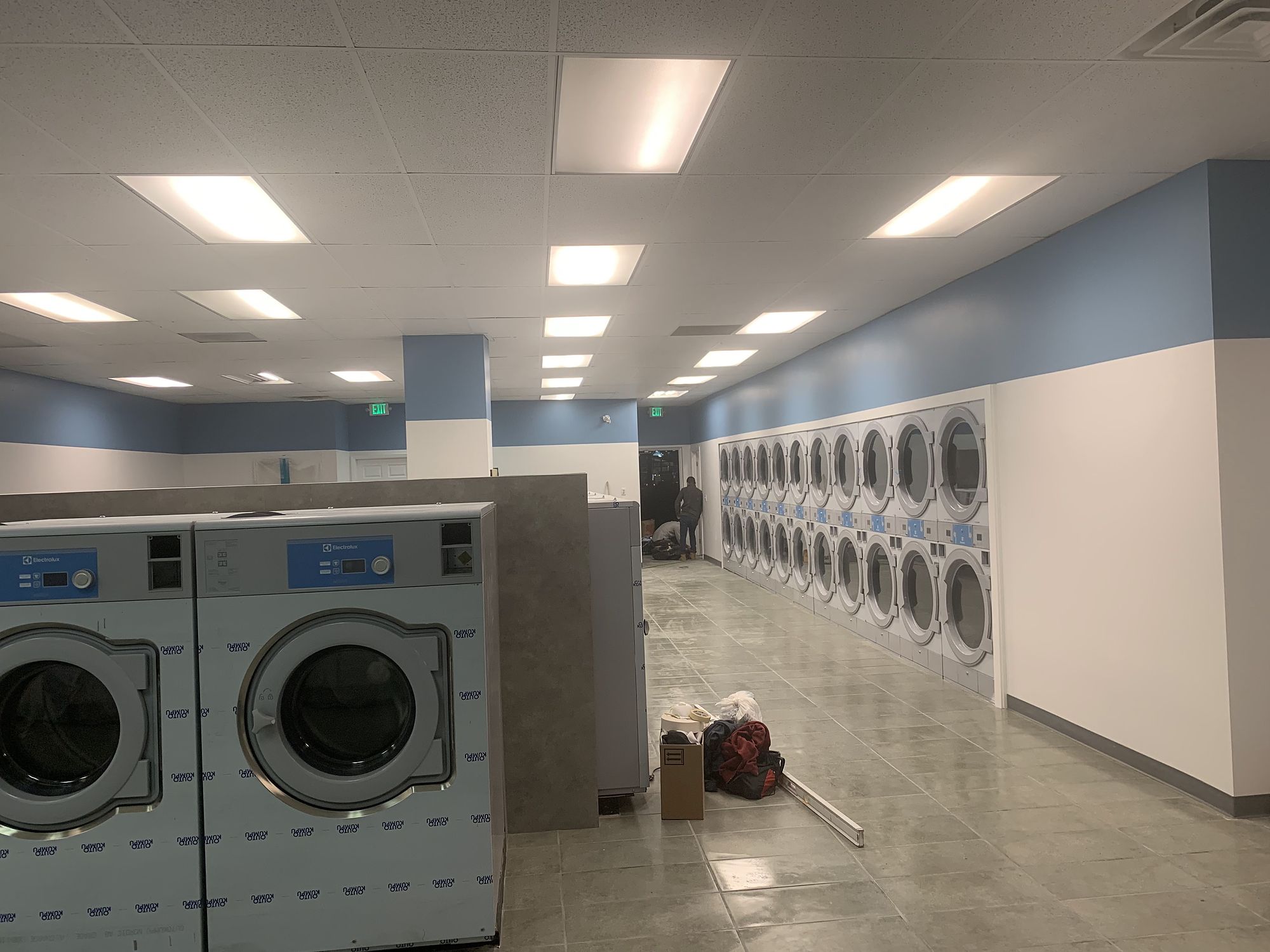 Laundromat build-out — Empty shells turned into working businesses.
